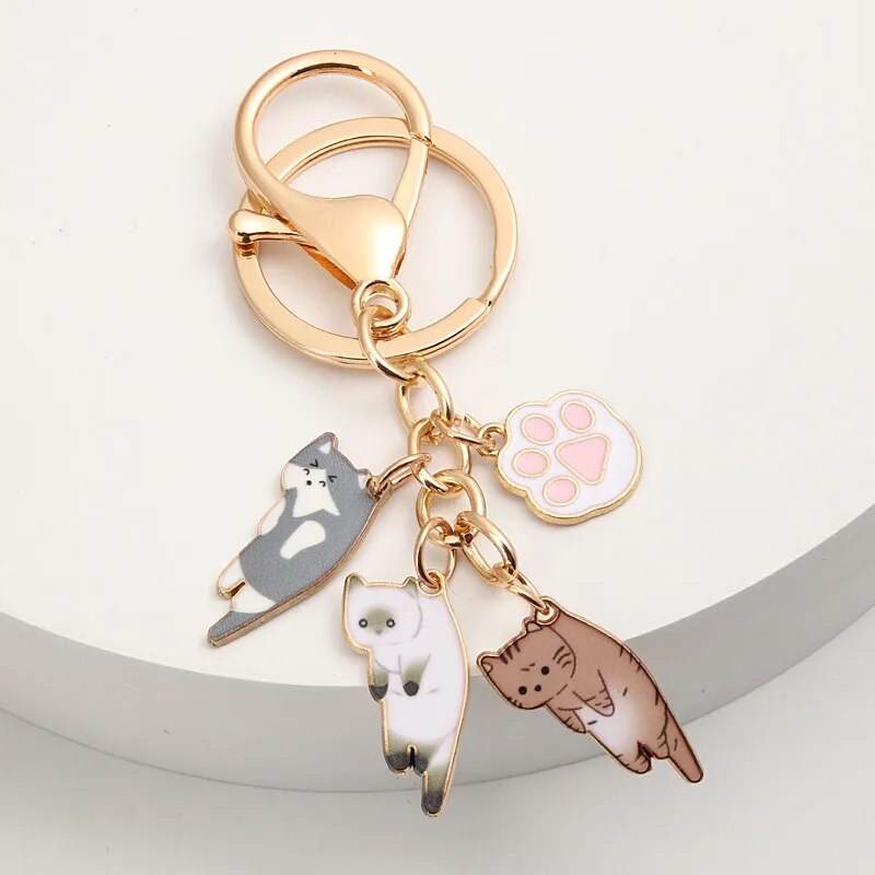 Porte-clés en Métal Doré Multi-Chats et Patte Rose – Image 4
