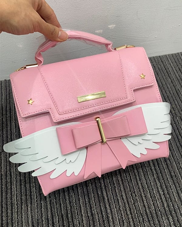 Sac à Main Rose Pâle à Ailes Blanches et Nœud Doré – Image 3